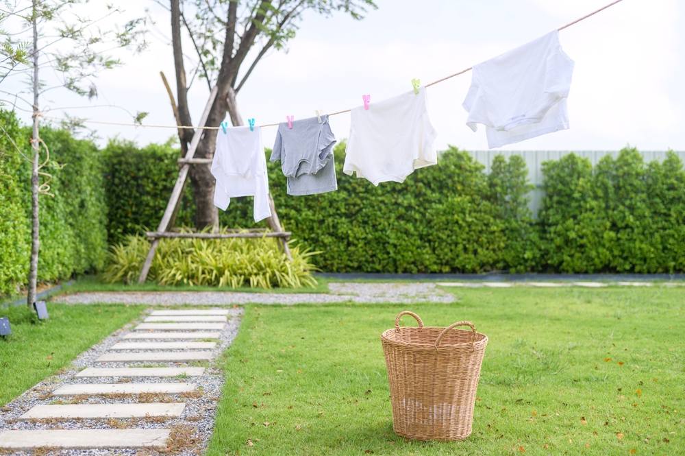 What Considerations Should Be Made When Drying Clothes Outside?